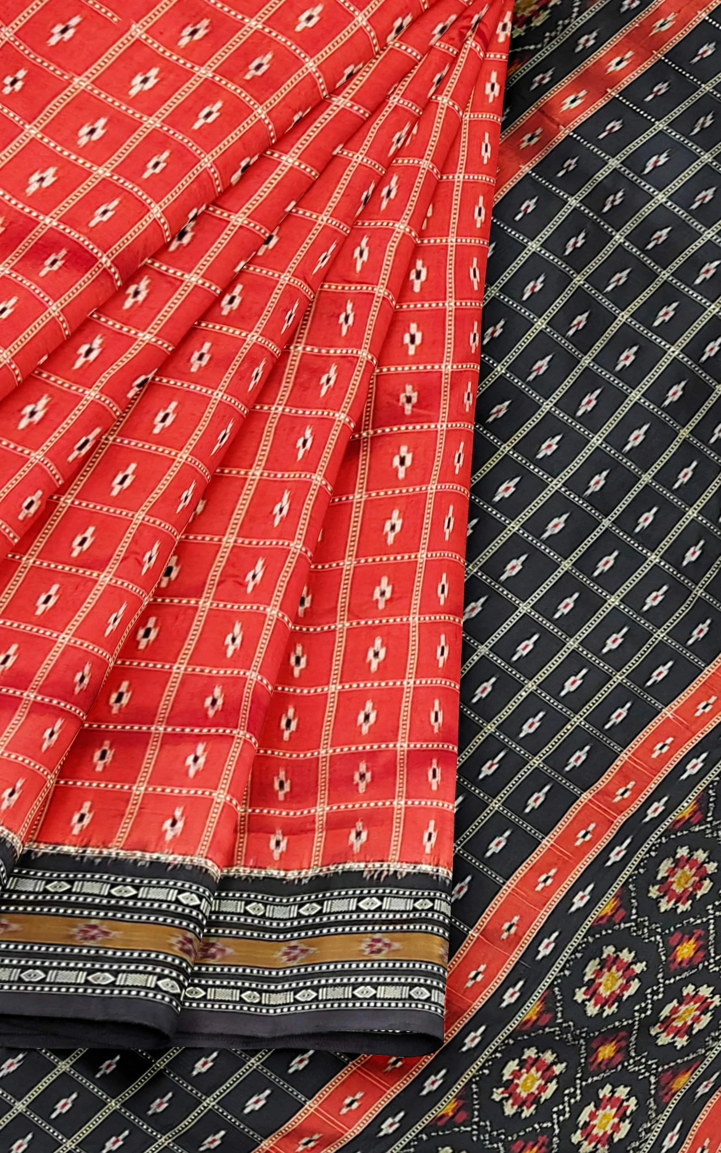 Divasutra Orange and Black Telia Silk Ikkat Saree