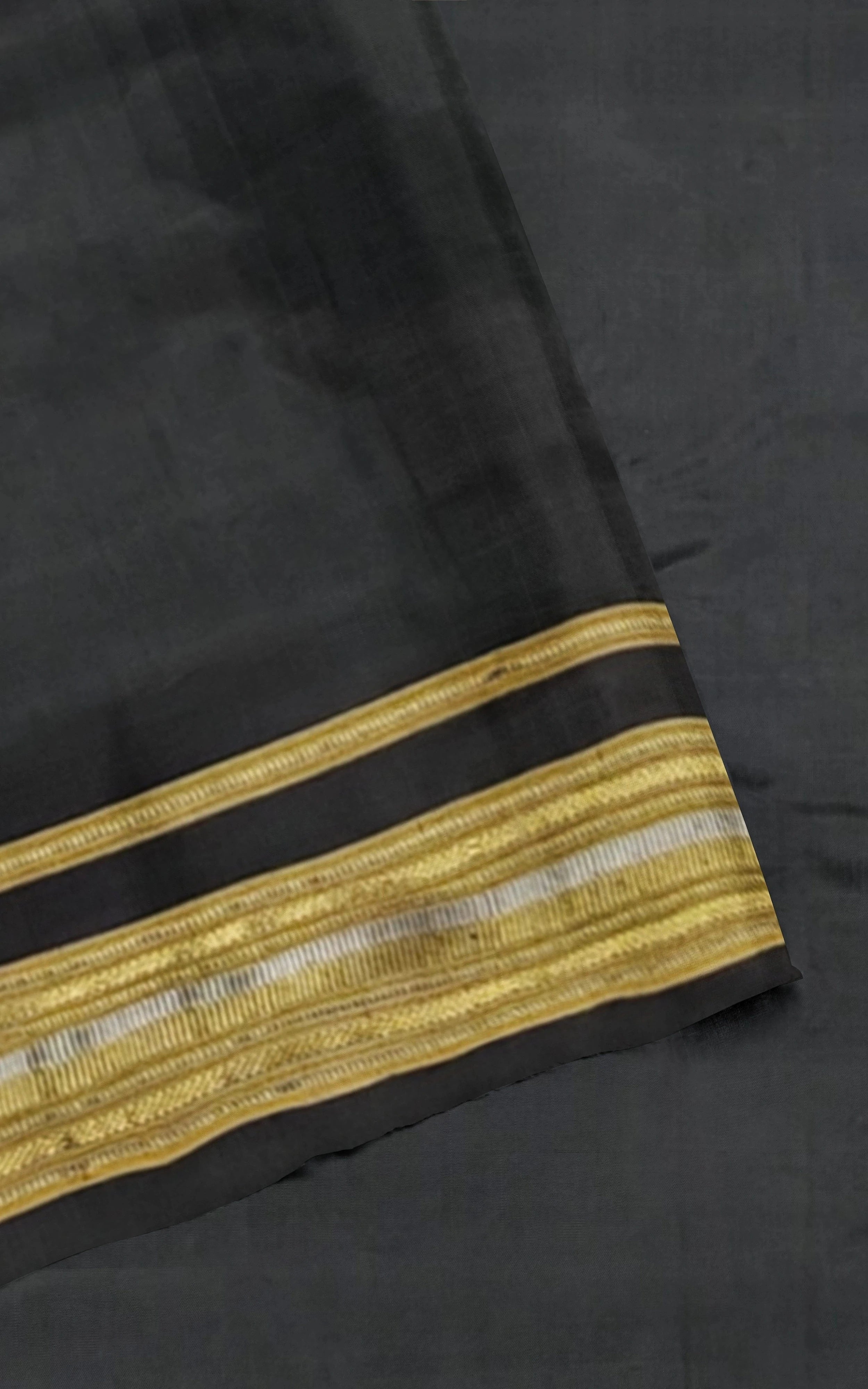 Divasutra Black and Golden Telia Silk  Ikkat Saree