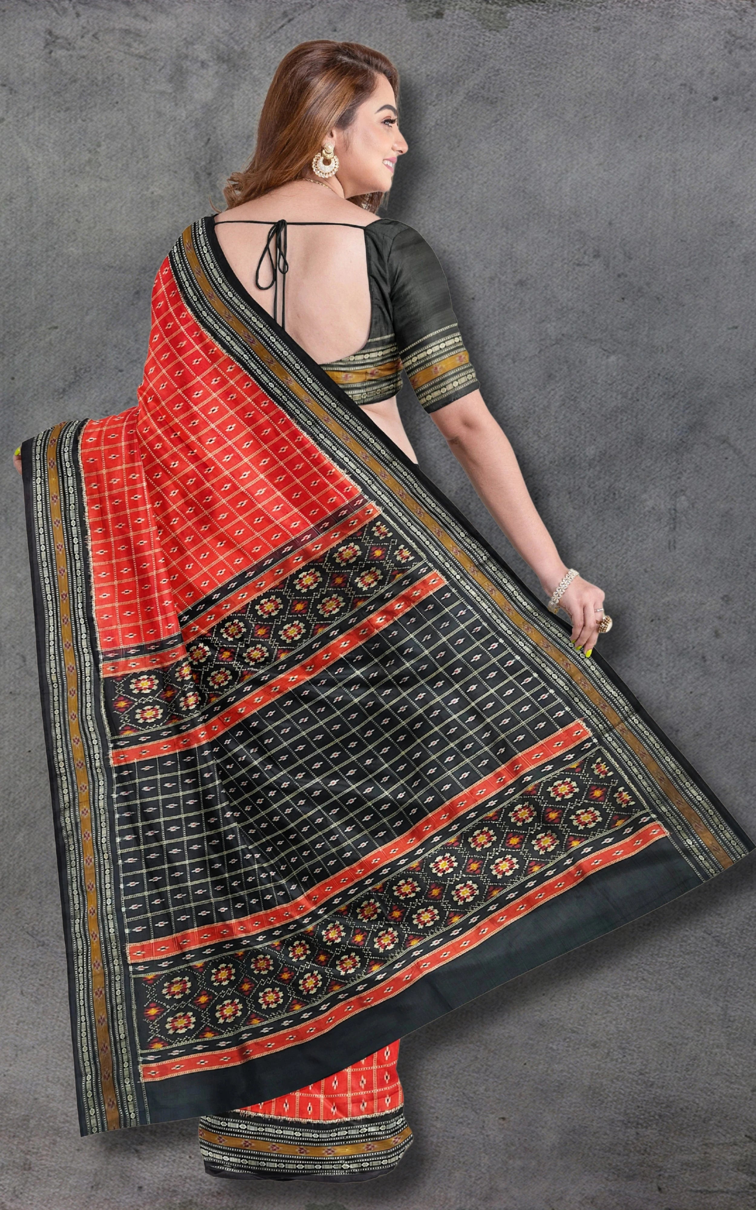 Divasutra Orange and Black Telia Silk Ikkat Saree